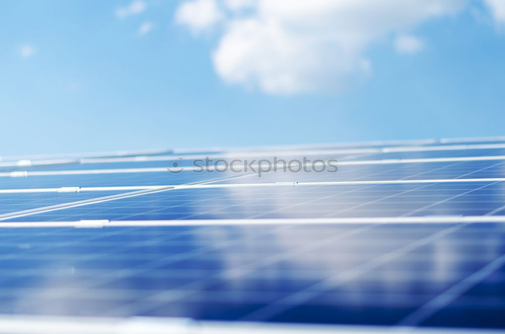 Similar – Photovoltaic panels in a solar power plant over a blue sky.