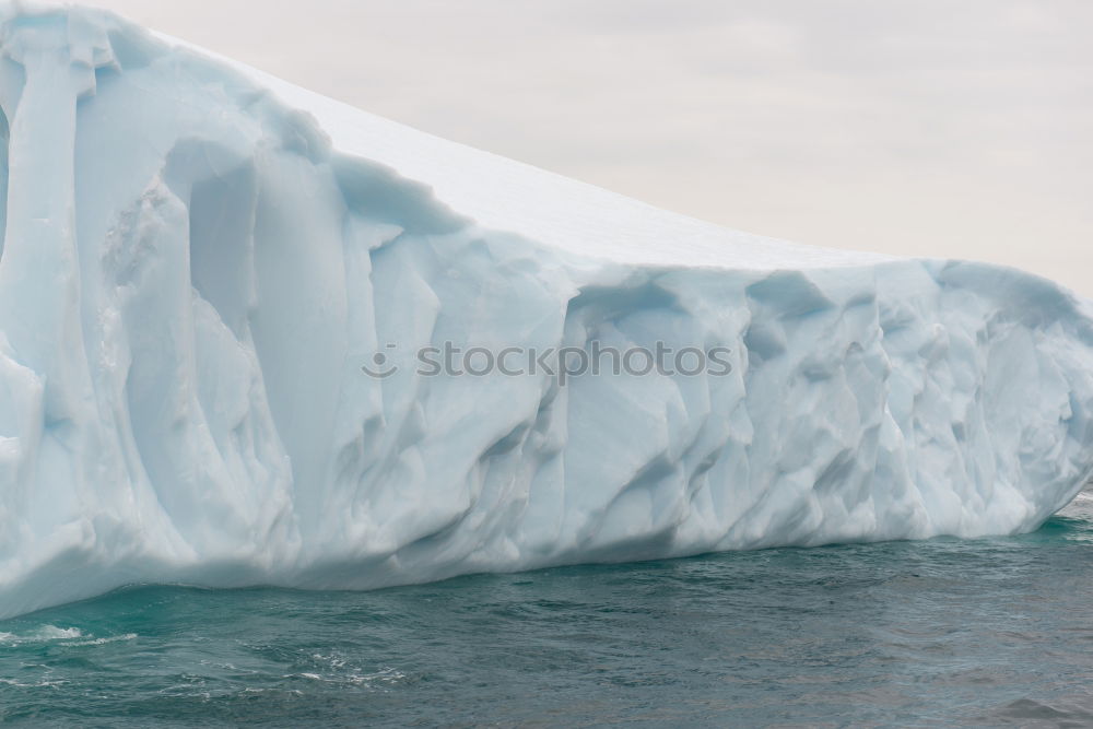 Similar – Wall of glacier in sea