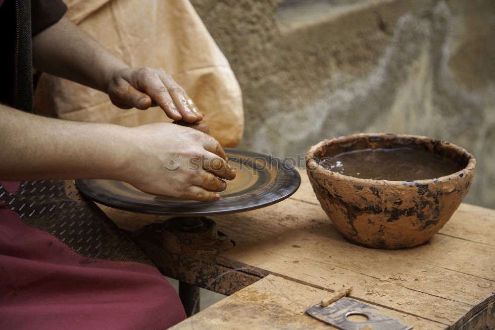 Similar – Image, Stock Photo Close-up of clay vase on wheel