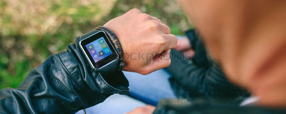 Similar – Woman using smartwatch touching touchscreen