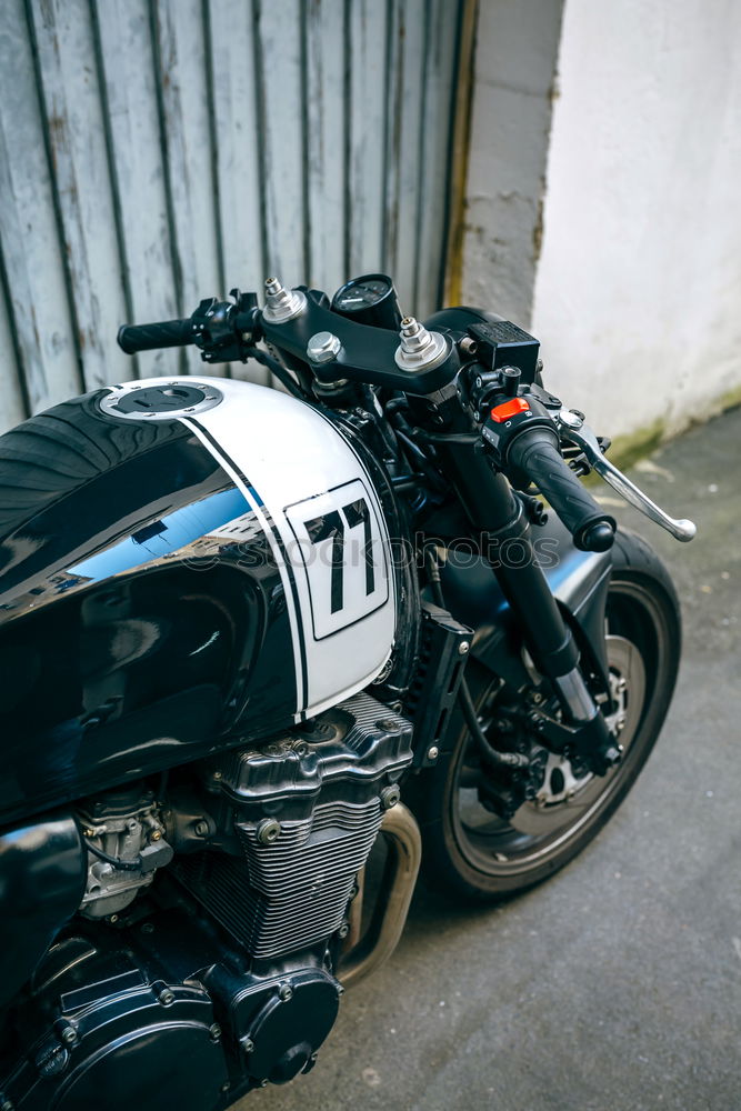 Similar – Image, Stock Photo Biker checking with a motorcycle