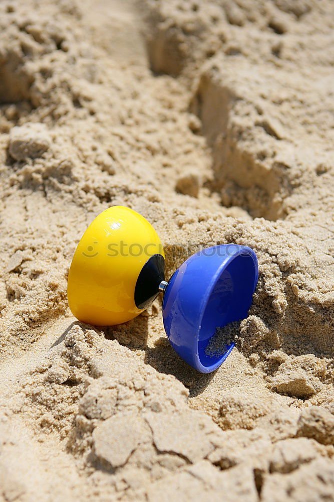 Similar – Image, Stock Photo Small child plays with bucket on the beach