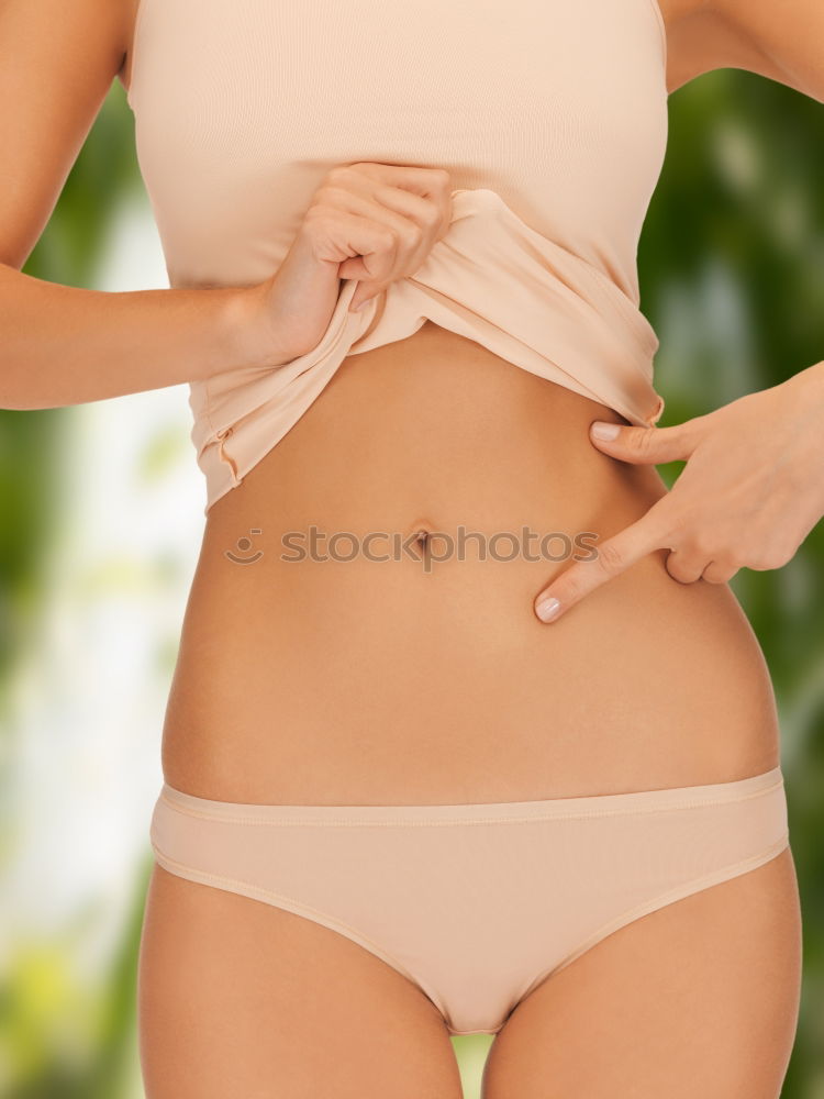 Similar – Image, Stock Photo Red bikini woman’s waist isolated on pink background. Mature woman fit body