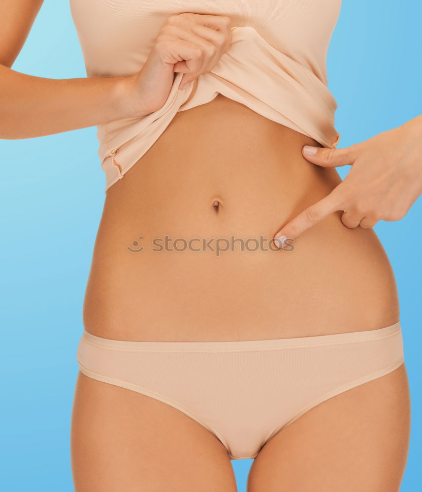 Similar – Image, Stock Photo Red bikini woman’s waist isolated on pink background. Mature woman fit body