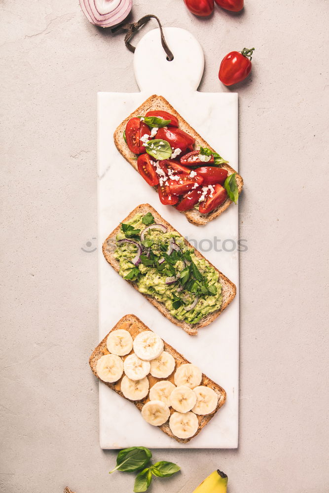 Similar – Parma ham with toast , basil pesto and tomatoes