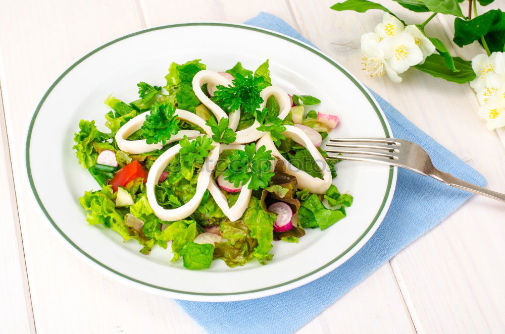 Similar – Mixed salad with baby leaves, radish, cucumber and feta cheese