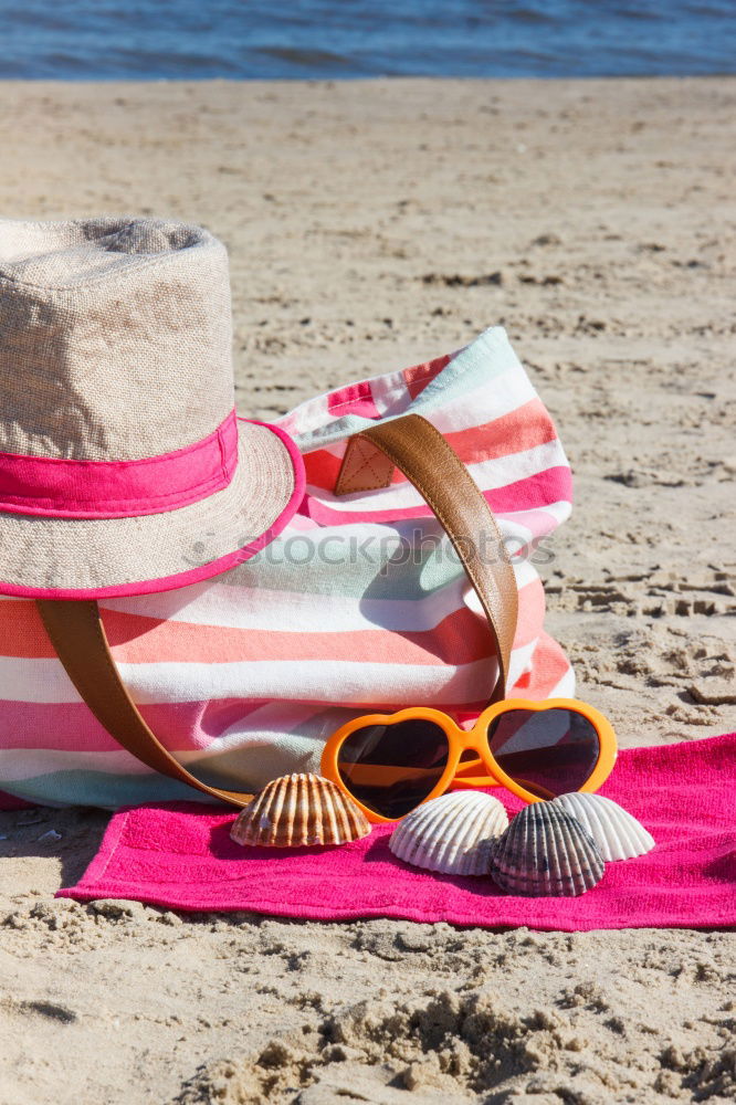 Similar – Image, Stock Photo Towel, beach ball, sunscreen and water gun on the beach