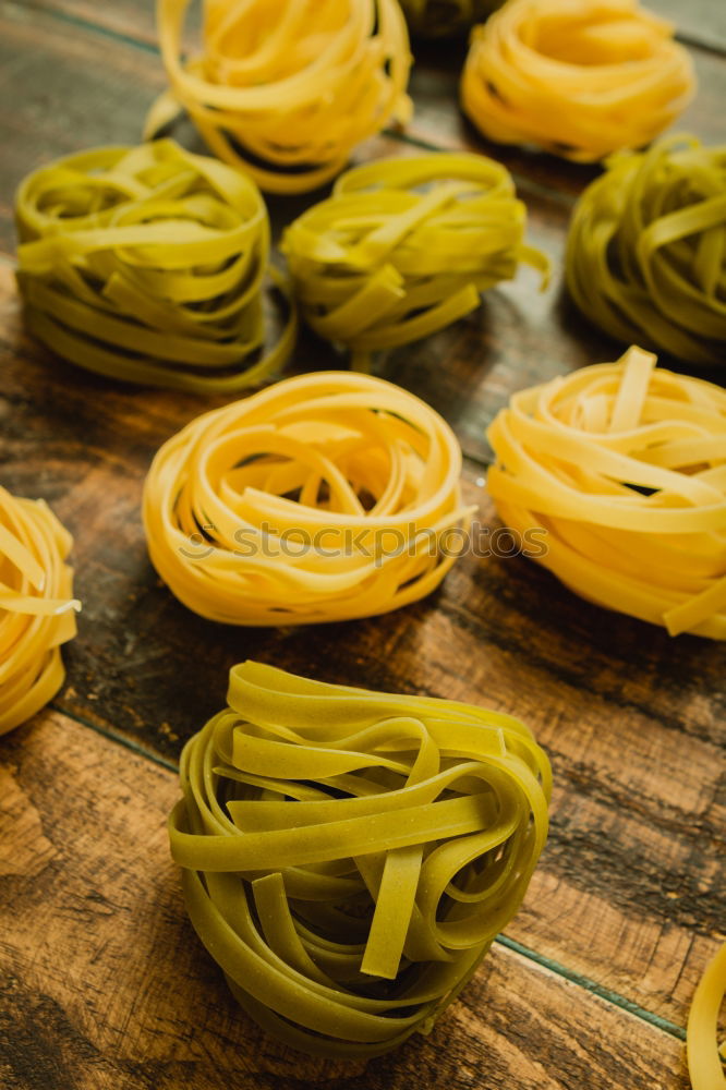 Similar – Raw tagliatelle on dark table