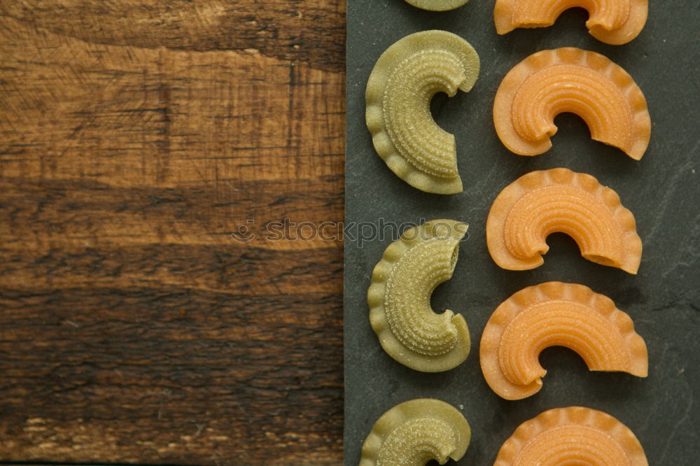 Similar – Raw farfalle pasta, basil and vegetables