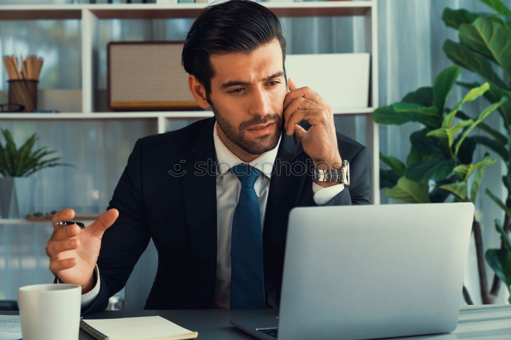 Similar – Image, Stock Photo Handsome businessman with striped tie sits at table with coffee making phone call and using his tablet