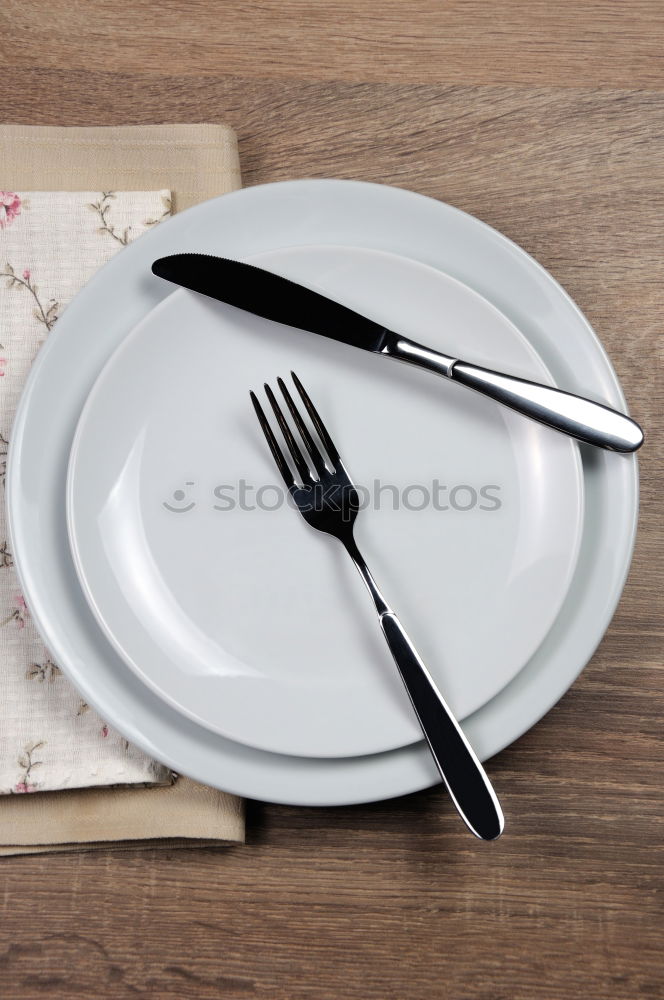 Similar – Half empty white plates, vintage knife and fork