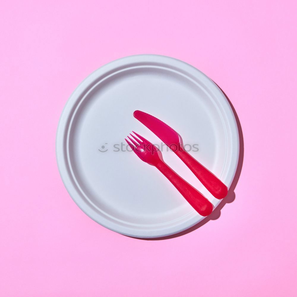 Similar – Disposable colorful plastic dish, straws and cups, cutlery. Flat lay on pink background.