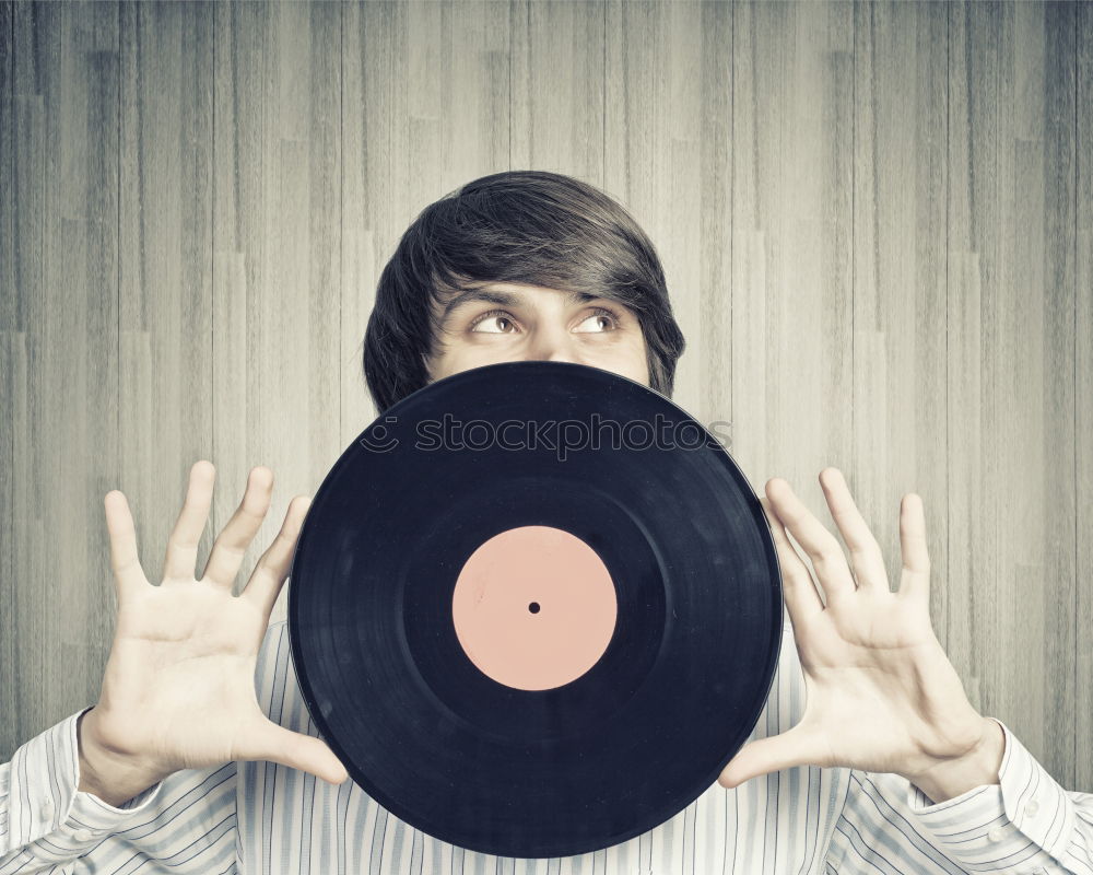 Similar – retro styled young woman poses with radio in front of old wooden gate. Music notes. tube radio