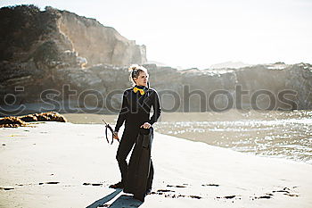 Similar – Image, Stock Photo Pensive bride with a red suitcase on the train tracks