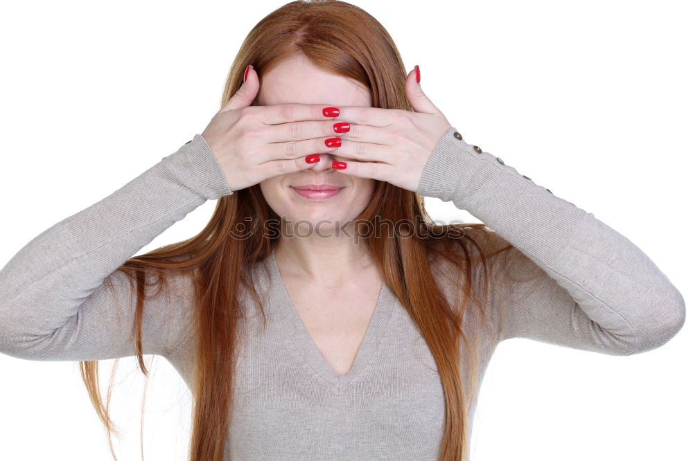 Similar – Woman with long red curly hair laughs looking at camera while holding a hand in front of her mouth