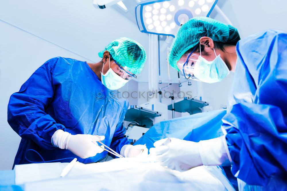 Similar – Image, Stock Photo Team of Surgeons Operating.