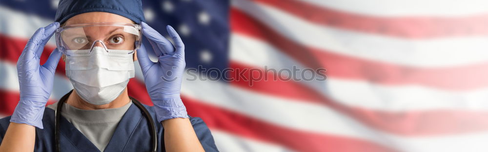 Similar – Man holds American flag in hand