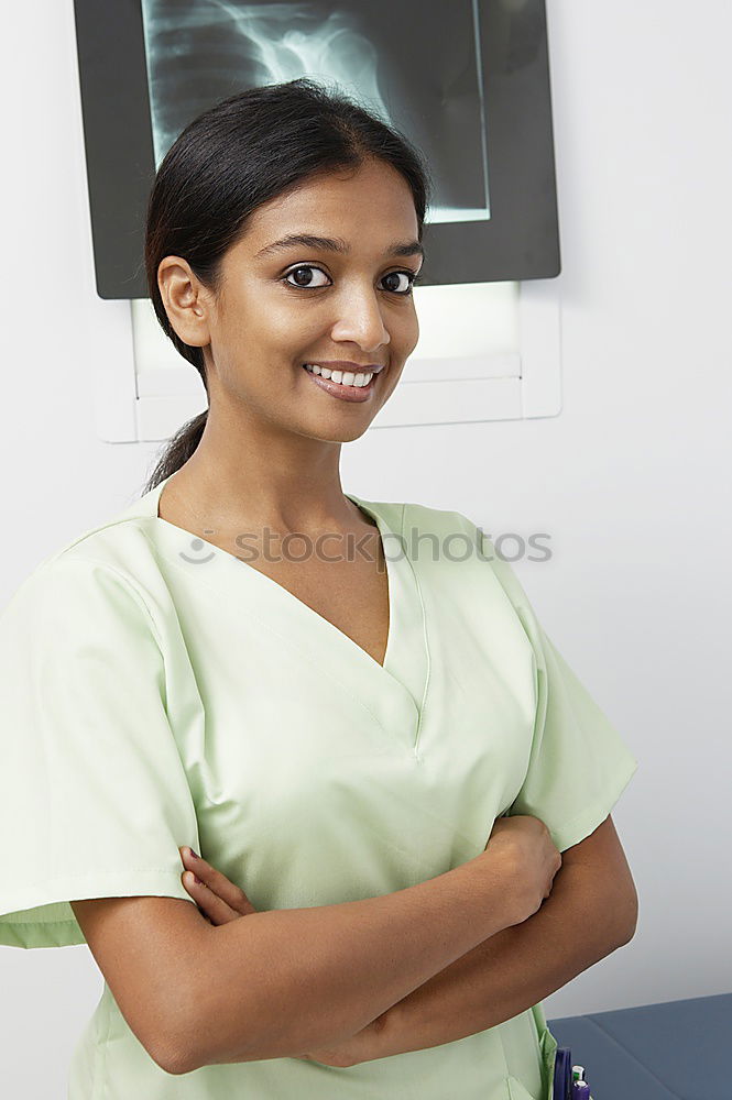 Similar – Smiling Female Doctor With Face Mask Wearing Scrubs In Busy Hospital During Health Pandemic