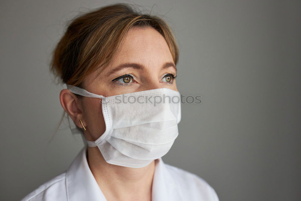 Similar – Brunette woman wearing a mask