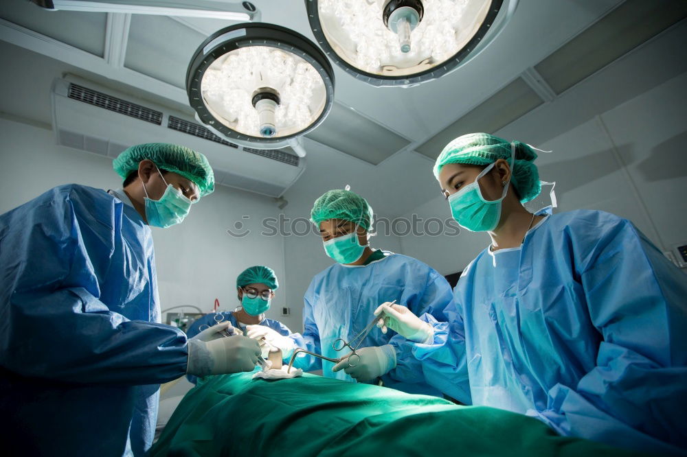 Similar – Image, Stock Photo Team of Surgeons Operating.