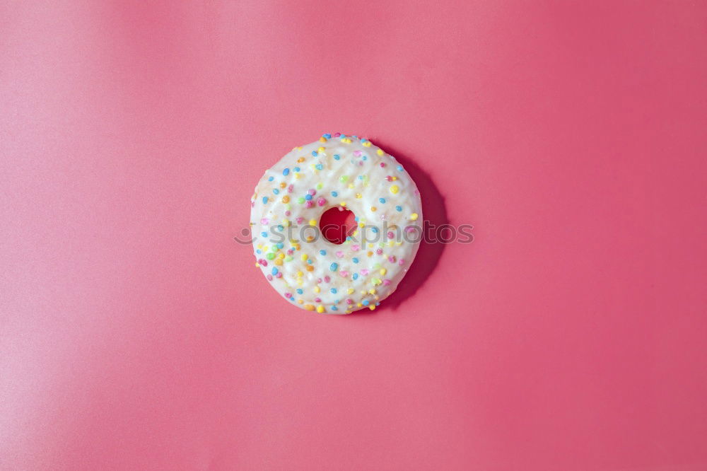 Similar – Sugar sweet donut on pink background