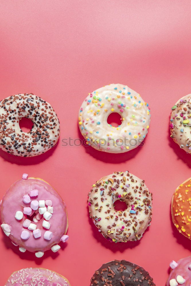 Similar – Sugar sweet donut on pink background