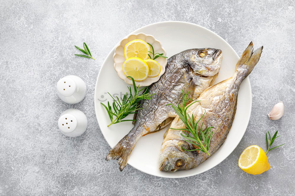 Similar – Background for fish dishes with gilthead and cooking spoon