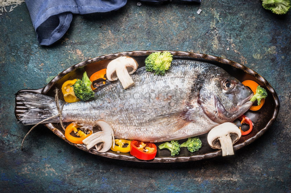 Similar – Image, Stock Photo Doardo fish with onion, lemon and spices