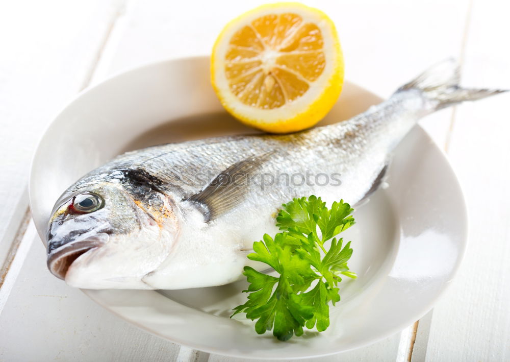 Similar – Dorado fish with ingredients for cooking