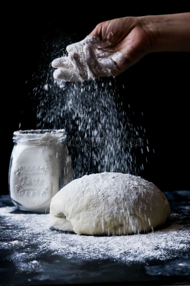 Similar – Image, Stock Photo white wheat flour in male hands, black background