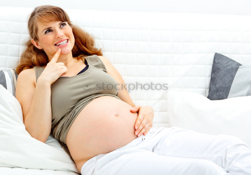 Similar – Pregnant woman touching her belly