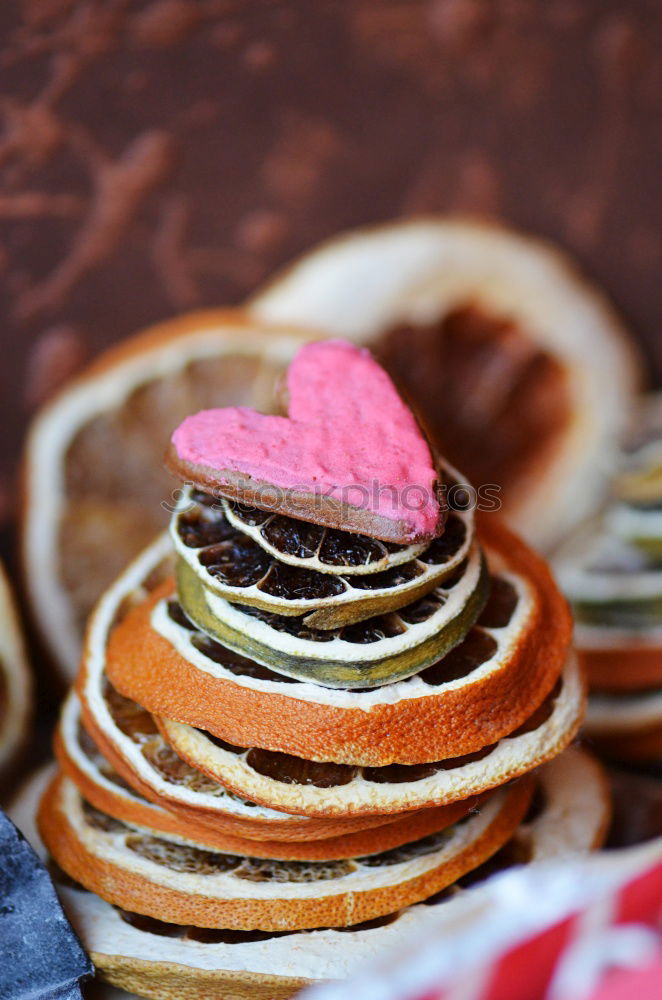 Similar – Image, Stock Photo A few gingerbread cookies wrapped in red ribbon on wooden table