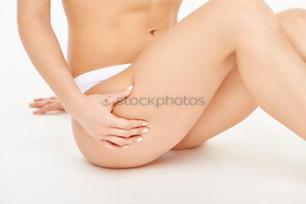 Similar – Top view of hands massaging female abdomen.