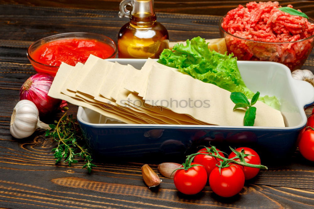 Similar – Image, Stock Photo Whole wheat lasagna sheets, vegetables and herbs