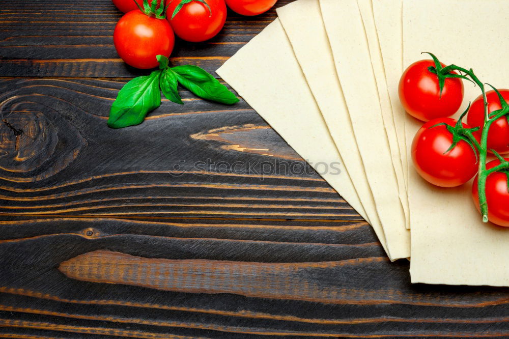 Similar – Image, Stock Photo cutting board with a knife and fresh red cherry tomatoes