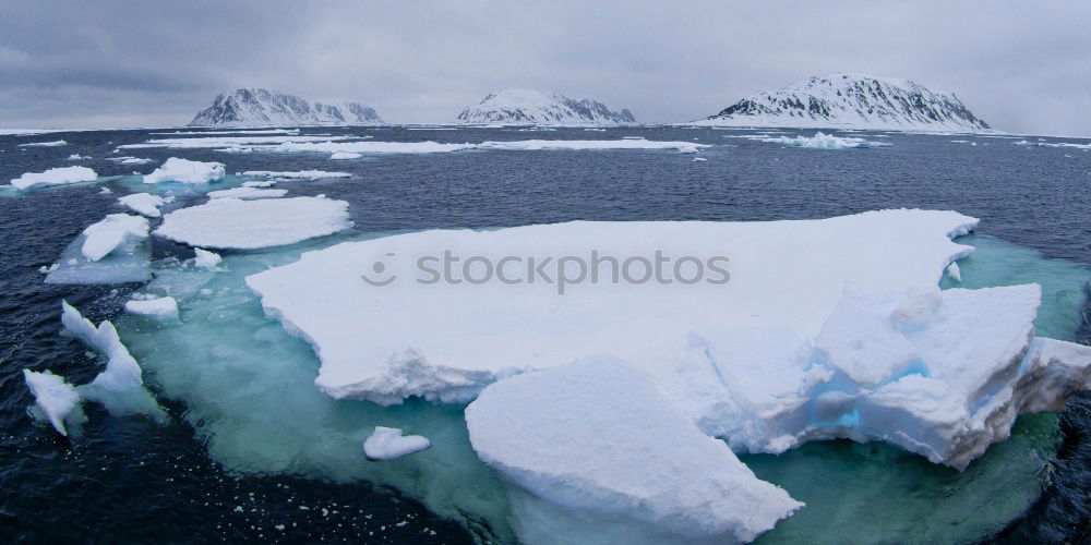 Similar – Snowfall and cruise liner among blue icebergs in Port Charcot