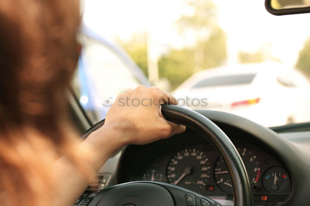 Similar – father teaching kid daughter to drive a car