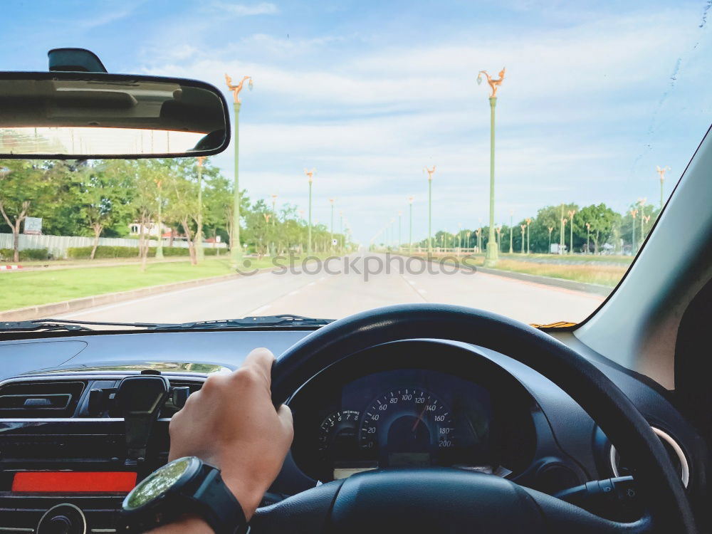 Similar – Image, Stock Photo Young man holding steering driving