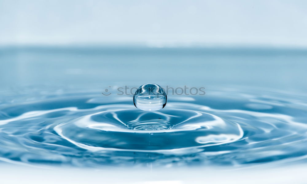 Similar – Woman’s hands holding a cup of clean sparkling water