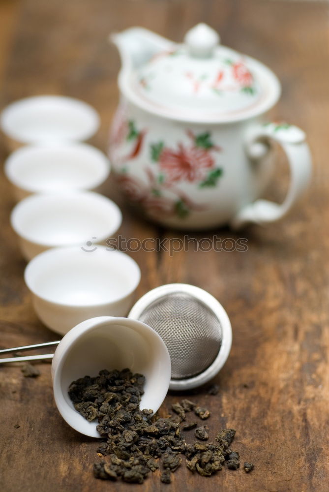 Similar – Black tea in a white cup and saucer and jasmine flowers