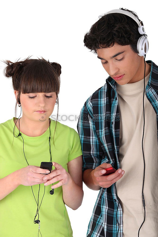 Similar – Image, Stock Photo Top shot of brother and sister listening to music together from smartphones