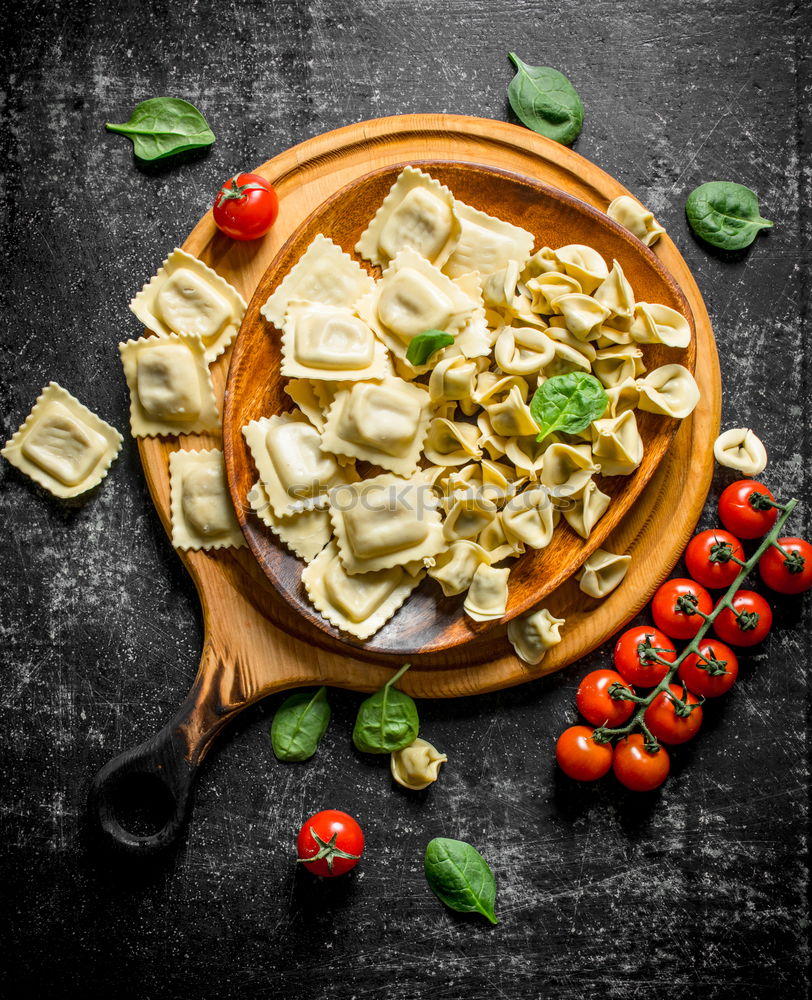 Similar – Image, Stock Photo Italian pasta with ingredients on a rustic background