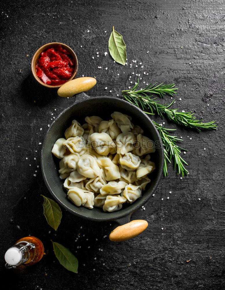 Similar – Vegetarian tortellini on the kitchen table with ingredients