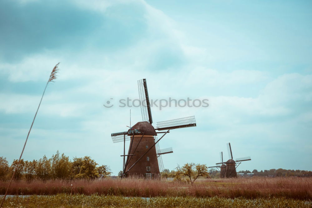 Similar – charming windmill by river at sunrise