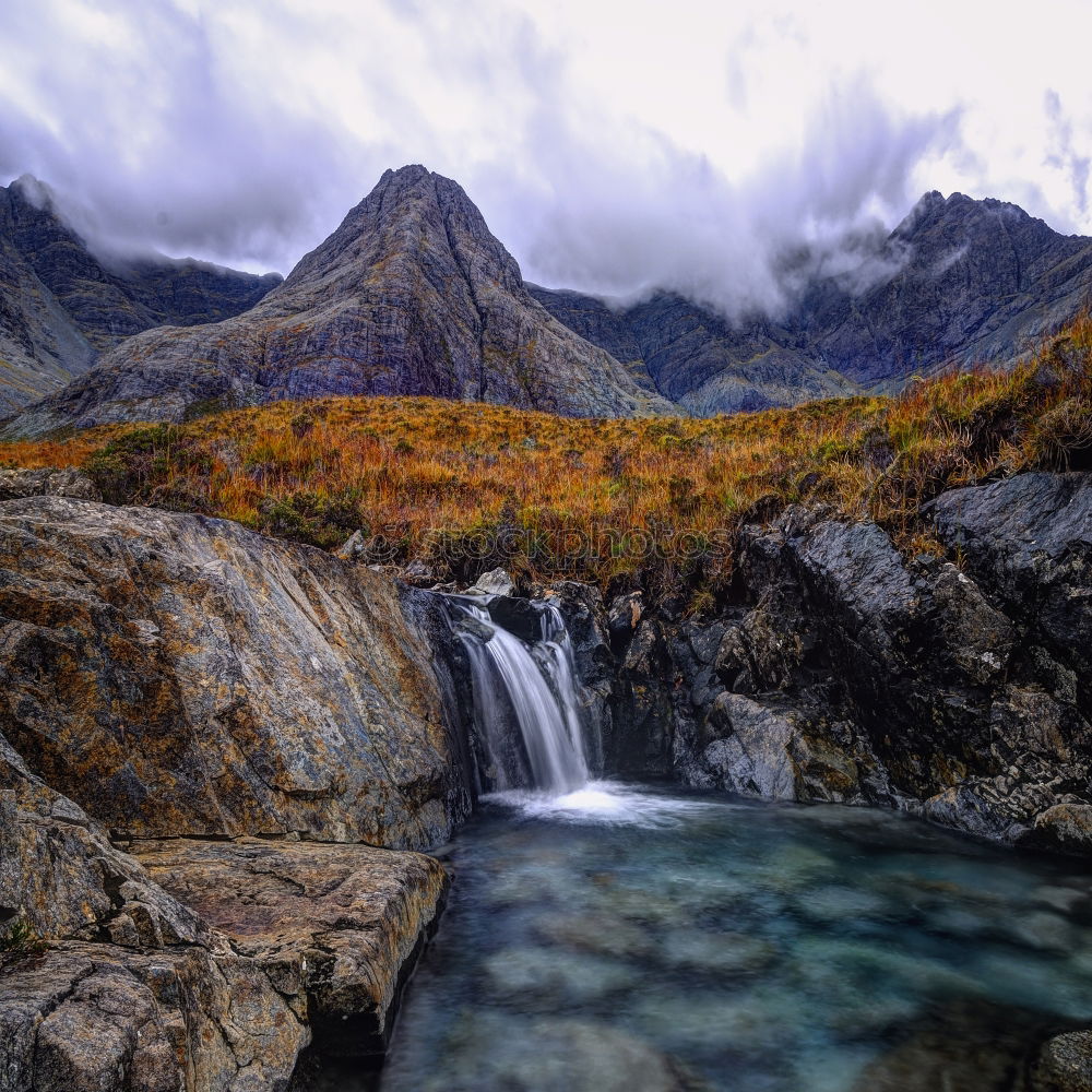 Similar – Isle of Skye: View of landscape with mountains and clouds I