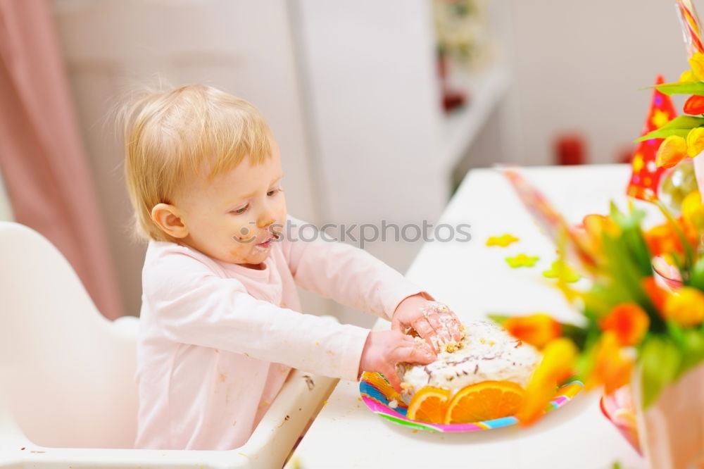 Similar – Girls tying baked Christmas gingerbread cookies with ribbon