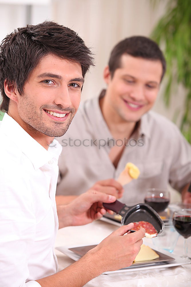 Similar – Young couple cooking. Man and woman in their kitchen