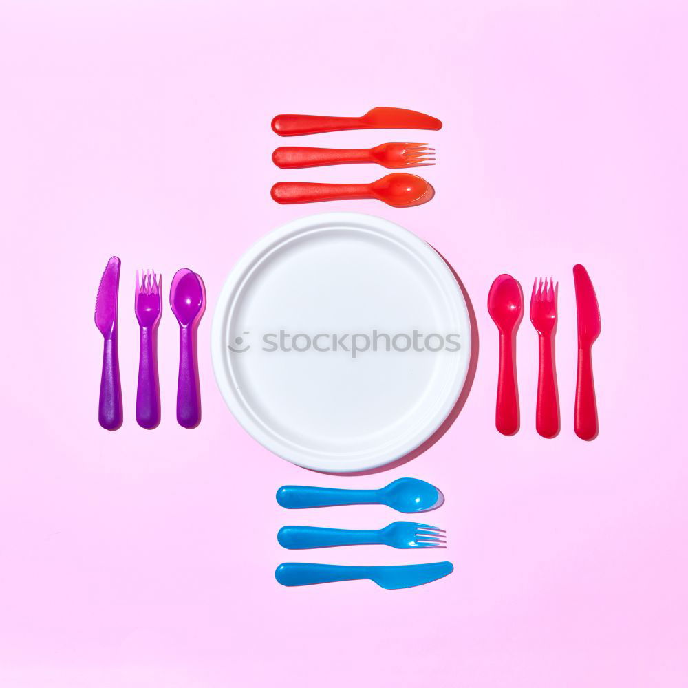 Similar – Disposable colorful plastic dish, straws and cups, cutlery. Flat lay on pink background.