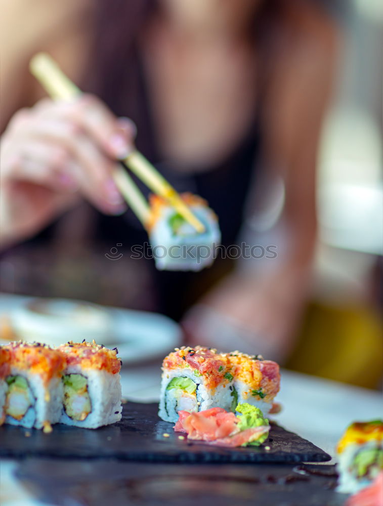 Similar – Crop woman eating sushi