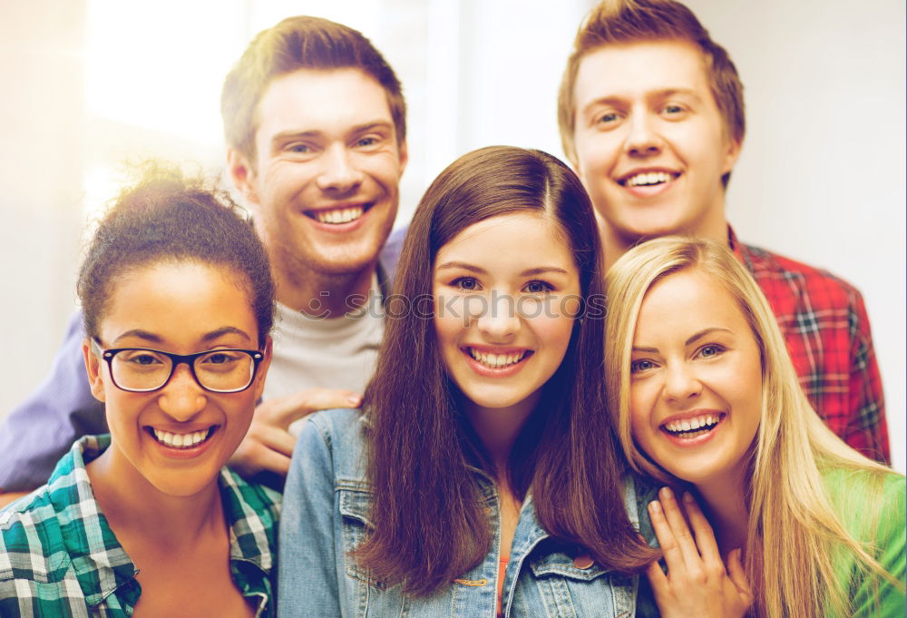 Similar – Group of multi-ethnic young people having fun together outdoors